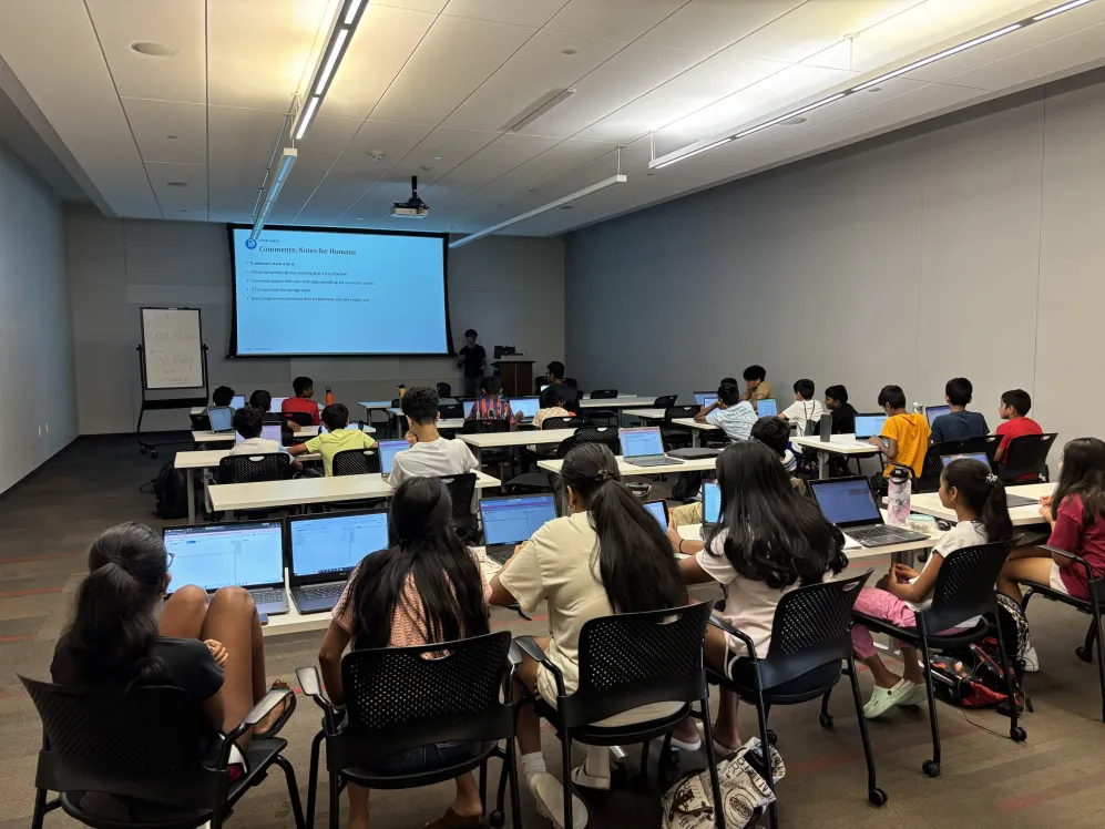 Students learning to code at a coding camp